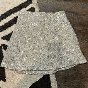 Gold sequin skirt. Kids size 14-16 or XL. Mid length. Great condition.